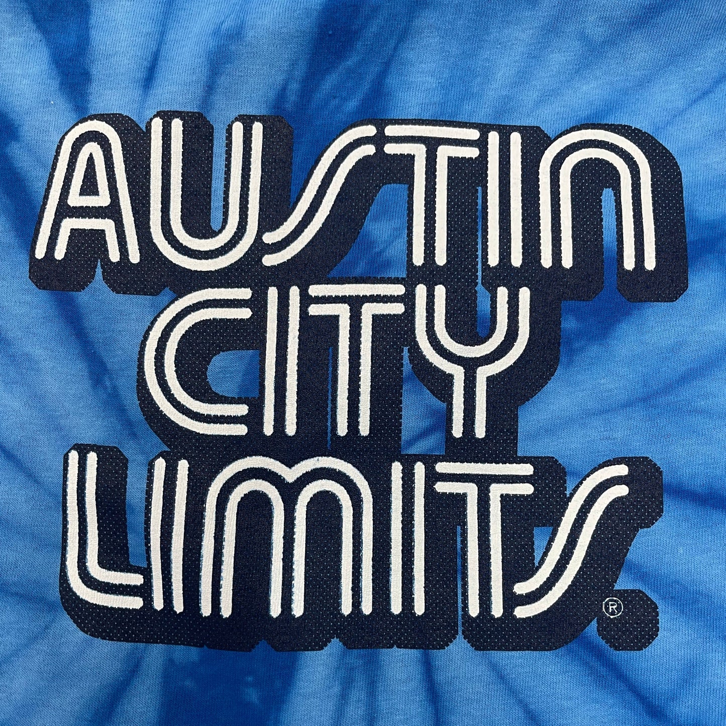 austin city limits close-up of graphic on tie dye tee