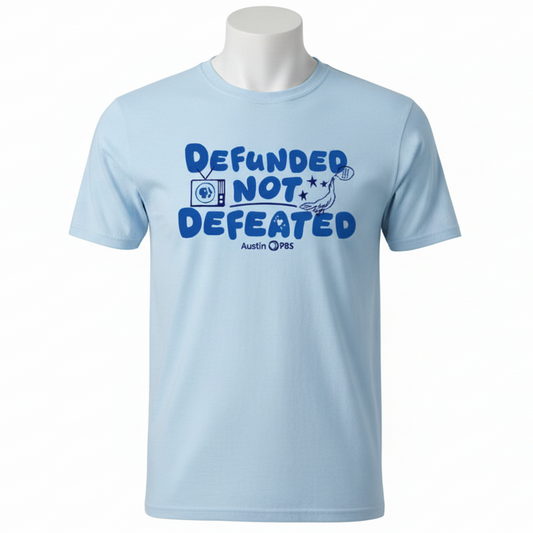 Light blue t-shirt with 'Defunded Not Defeated' text on a blue background