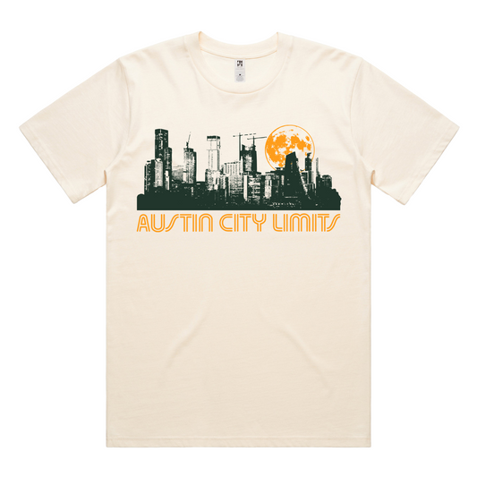 Beige t-shirt with Austin Skyline at night moon motif with Austin City Limits graphic on a white background