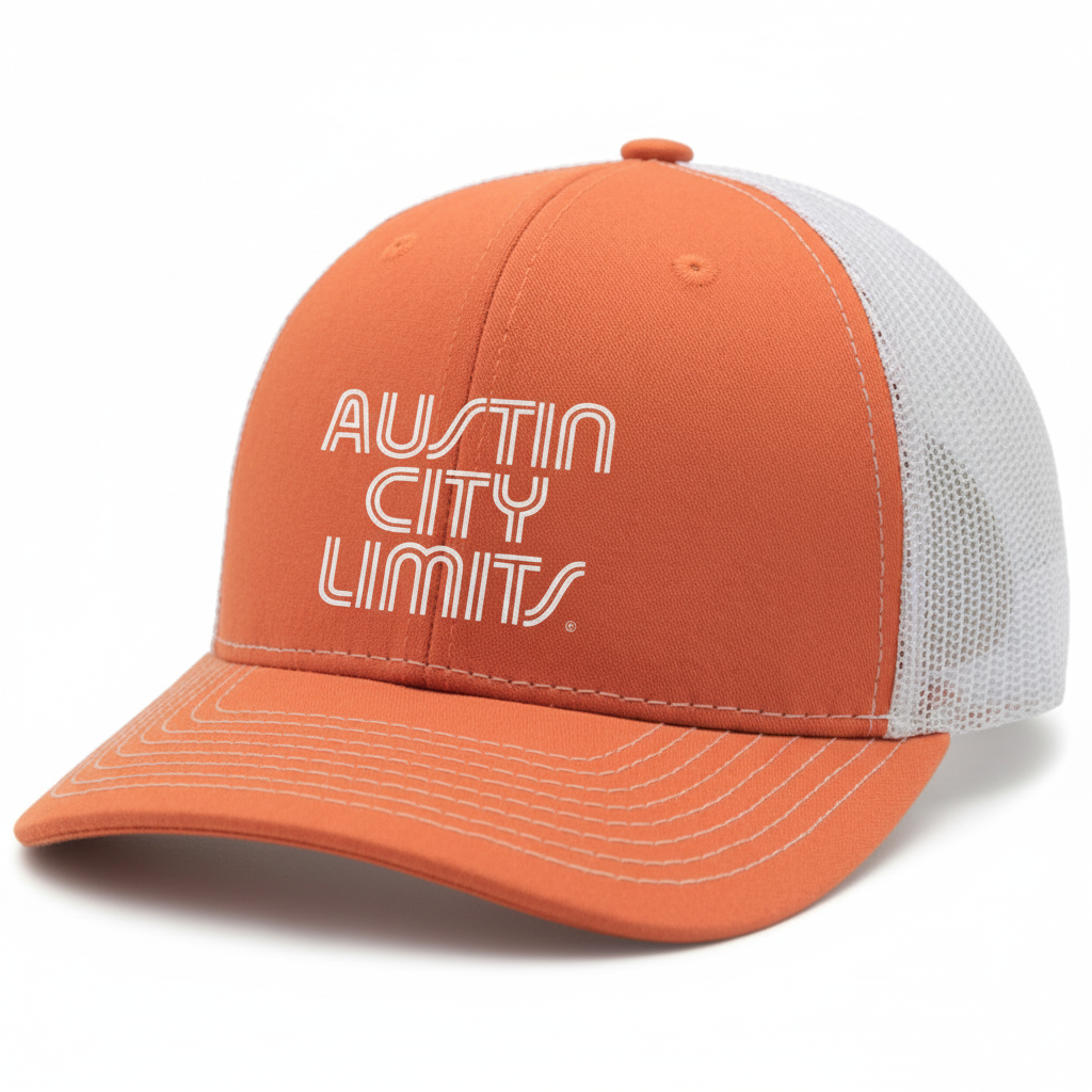 A burnt orange and white trucker hat with 'AUSTIN CITY LIMITS' text on the front.
