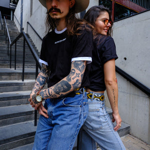 Paul Val and Sisi wearing Austin City Limits tees