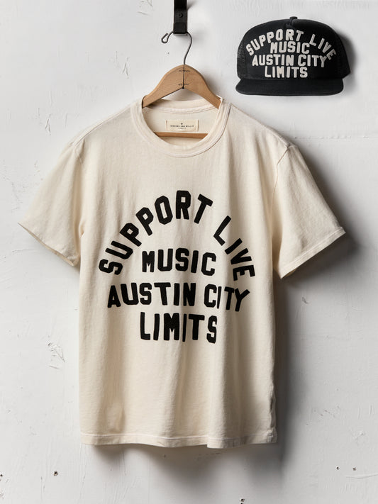 Beige t-shirt with 'Support Live Music Austin City Limits' text and a black cap on a white background