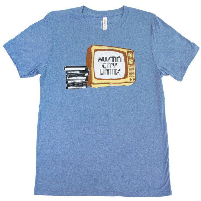 A blue unisex T-shirt with a graphic print of a television set and the text 'Austin City Limits'. The shirt also features a barcode and the brand 'Bella+Canvas'.