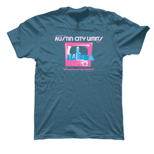 A blue-colored unisex t-shirt featuring a graphic print of 'Austin City Limits' with a skyline and TV logo in pink and white.